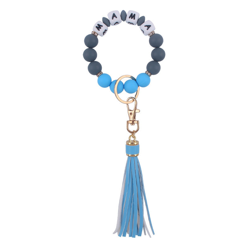 Venta al por mayor Llavero de muñeca con cuentas de estampado de leopardo de silicona